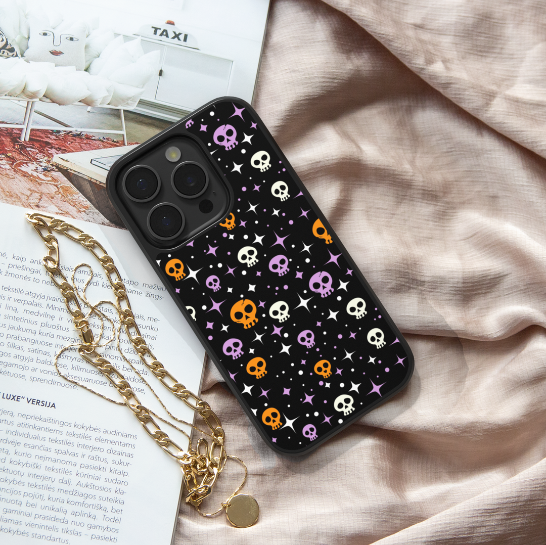 Halloween phone case with cute black cats, spooky ghosts, bats, bones, and spider webs – Halloween aesthetic design for iPhone and Samsung.