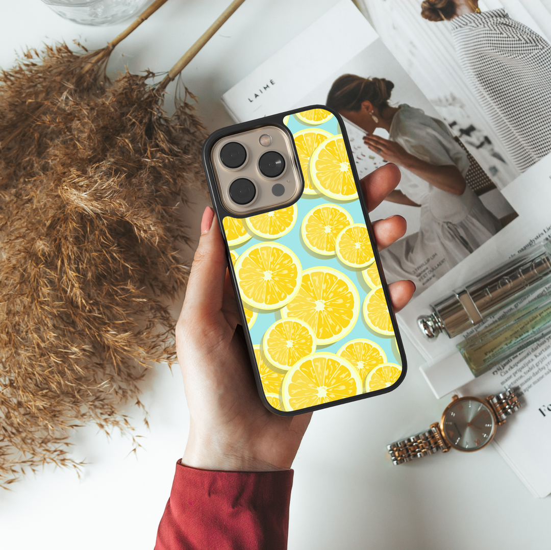 Phone case featuring yellow lemon slices on a light blue background – cute fruit summer aesthetic for iPhone and Samsung