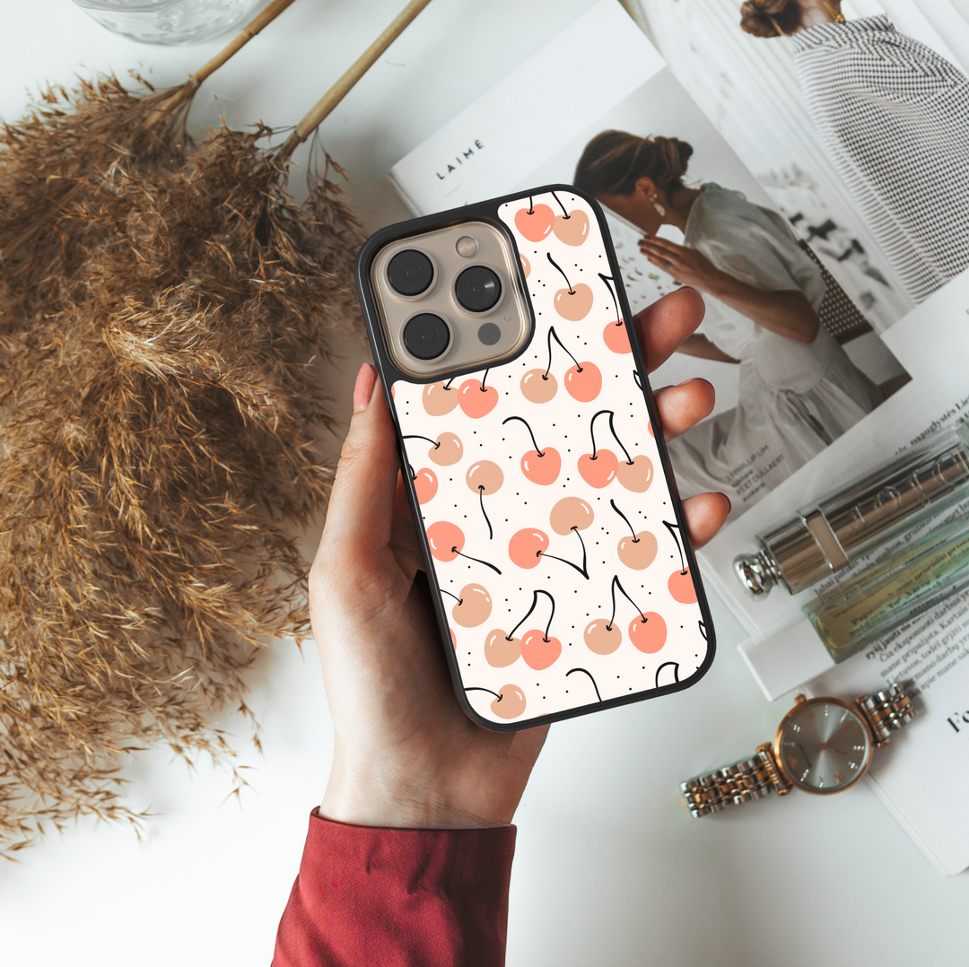 Minimal peach and coral cherry phone case with dotted background – aesthetic fruit design for iPhone and Samsung models