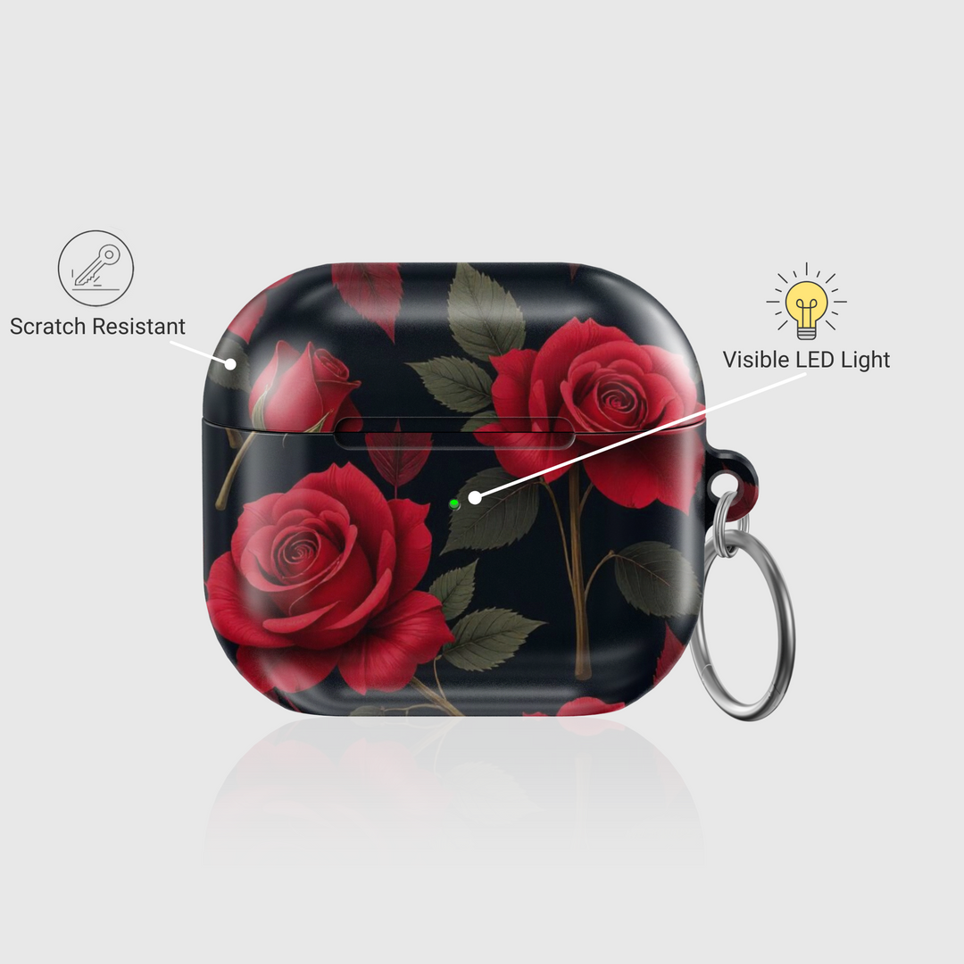 Glossy AirPods case with deep red rose floral design on a black background, featuring a silver keychain—romantic and elegant accessory for music lovers.
