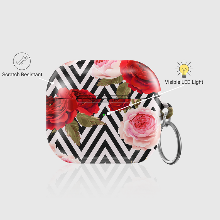 Stylish AirPods case featuring a bold black-and-white chevron pattern with red and pink roses, complete with keychain—chic and protective accessory for music lovers.