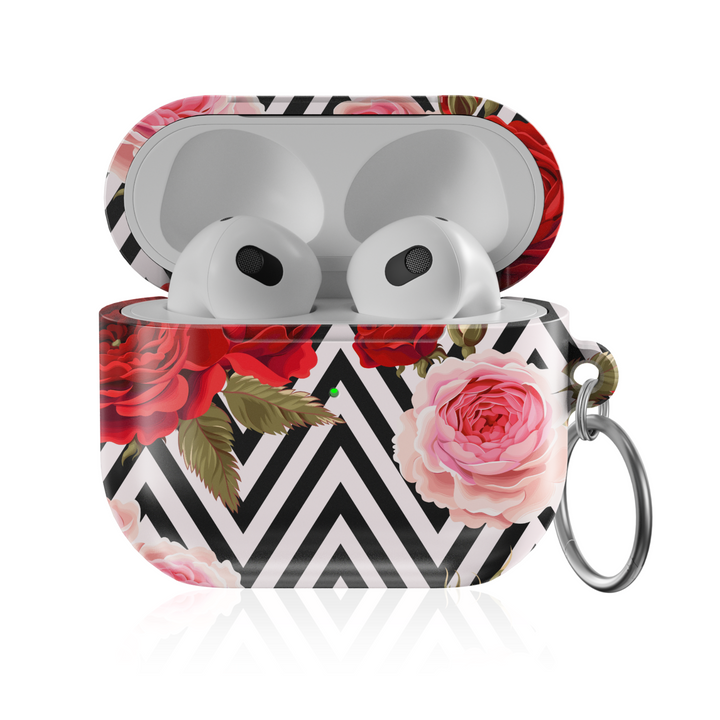 Stylish AirPods case featuring a bold black-and-white chevron pattern with red and pink roses, complete with keychain—chic and protective accessory for music lovers.