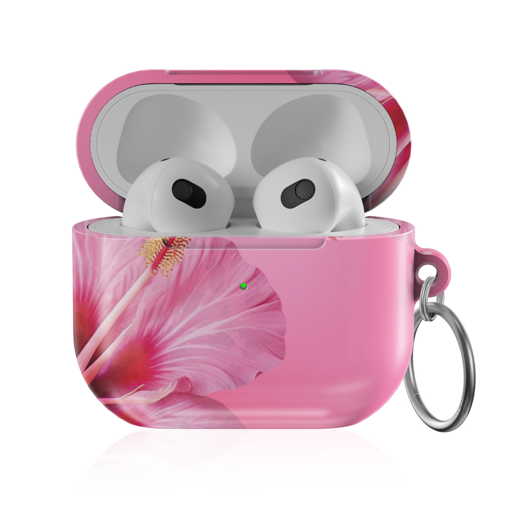Pink AirPods case with large hibiscus flower print, tropical floral design, and silver keychain—stylish and protective earbud cover for a summery music vibe.