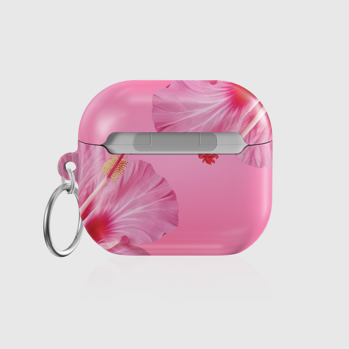 Pink AirPods case with large hibiscus flower print, tropical floral design, and silver keychain—stylish and protective earbud cover for a summery music vibe.