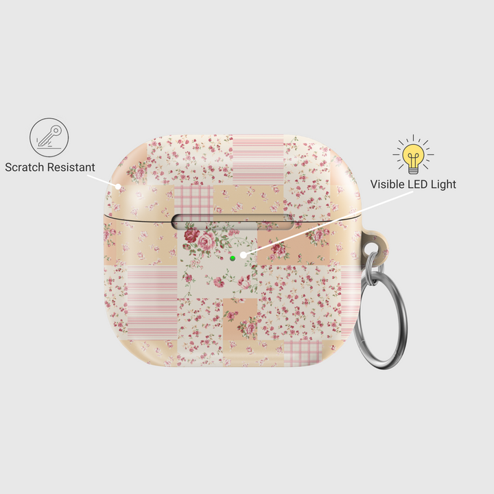 AirPods case featuring a vintage patchwork design with pastel floral patterns, soft pink and beige tones, and a silver keychain—charming and protective earbuds cover with a cottagecore aesthetic.