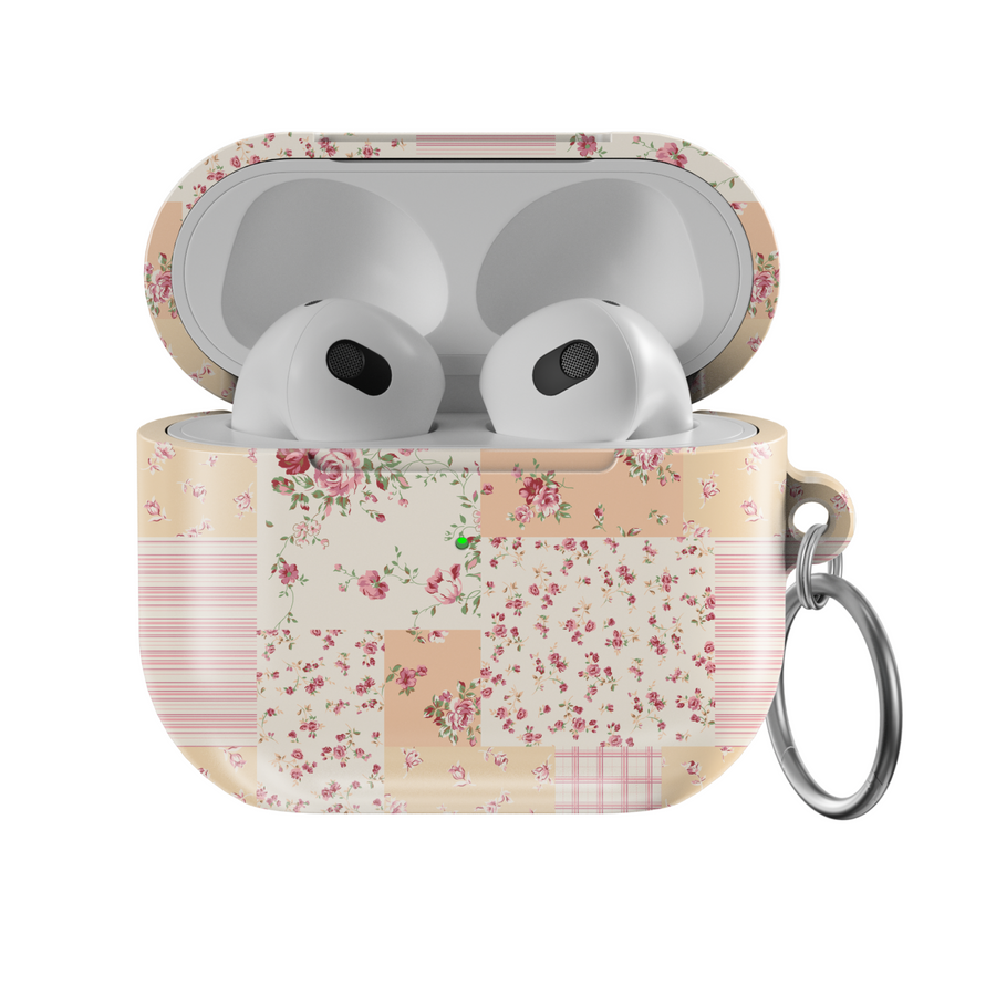 AirPods case featuring a vintage patchwork design with pastel floral patterns, soft pink and beige tones, and a silver keychain—charming and protective earbuds cover with a cottagecore aesthetic.