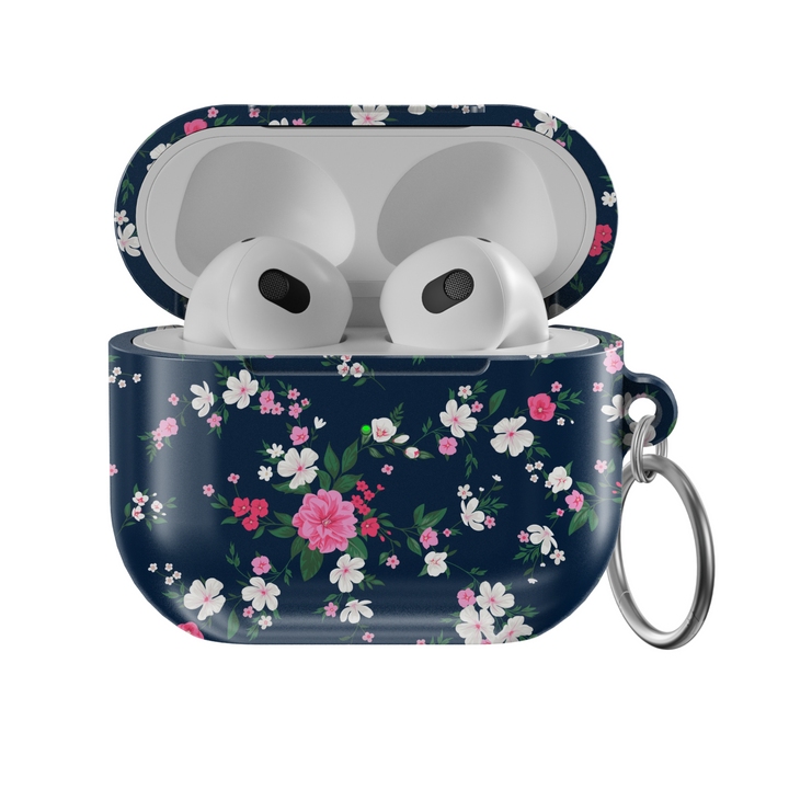Glossy navy AirPods case with pink and white floral pattern and green leaves, designed with a silver keychain—chic and protective cover for music lovers.