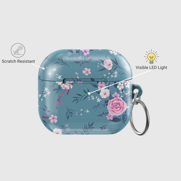 Glossy teal AirPods case with elegant pink and white floral design, featuring a secure keychain ring. A chic and music-inspired protective cover for AirPods Pro and AirPods 3.