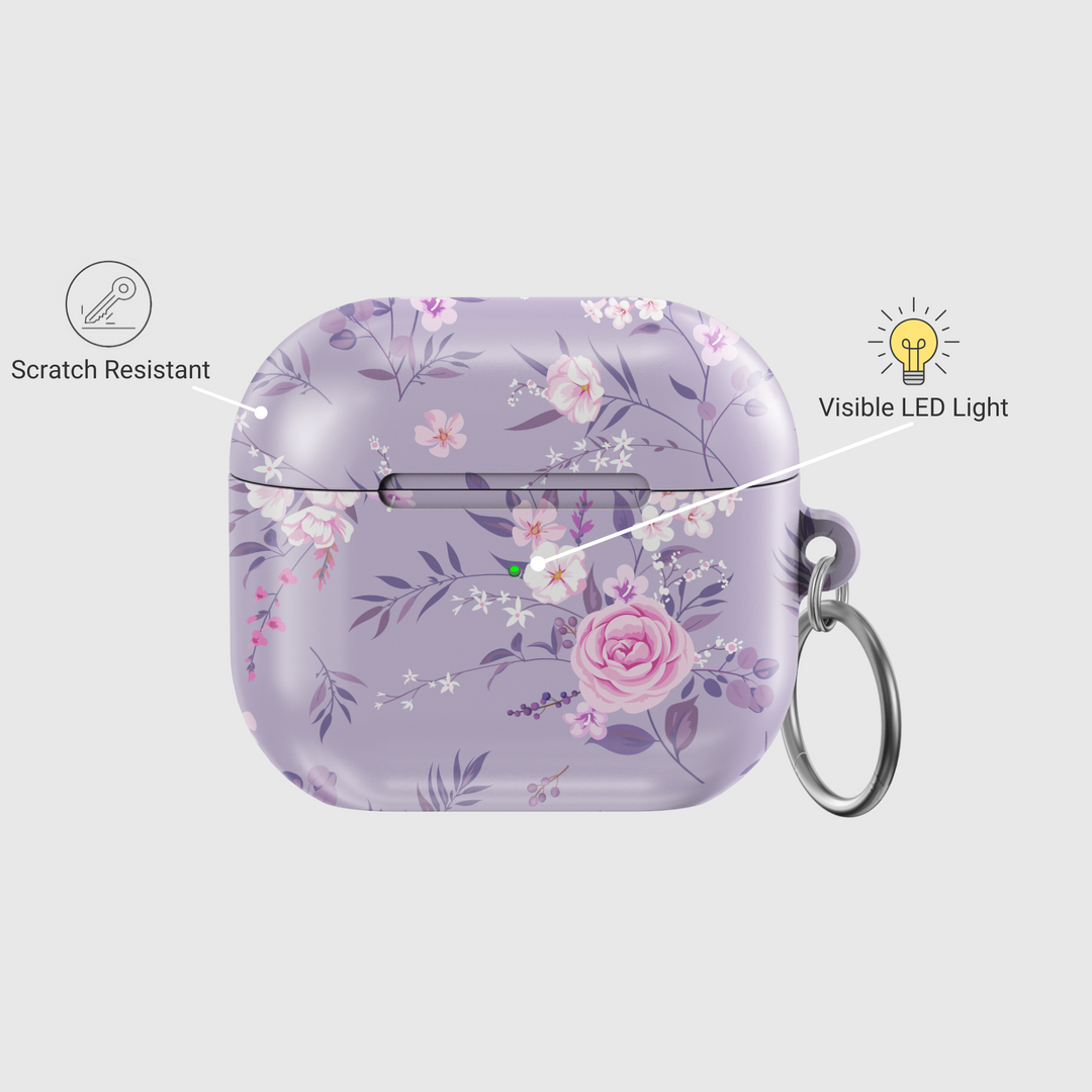 Elegant purple AirPods case with a soft pink and white floral pattern, featuring a silver keychain ring. Music-inspired aesthetic perfect for feminine, romantic styles. Fits AirPods Pro and AirPods 3.