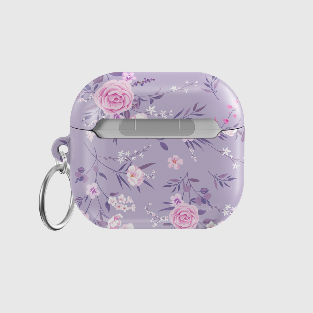 Elegant purple AirPods case with a soft pink and white floral pattern, featuring a silver keychain ring. Music-inspired aesthetic perfect for feminine, romantic styles. Fits AirPods Pro and AirPods 3.