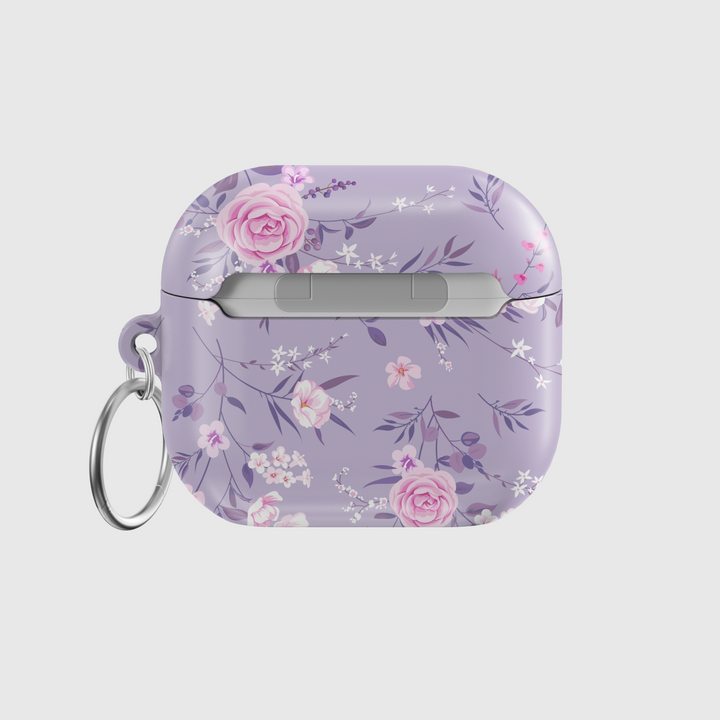 Elegant purple AirPods case with a soft pink and white floral pattern, featuring a silver keychain ring. Music-inspired aesthetic perfect for feminine, romantic styles. Fits AirPods Pro and AirPods 3.