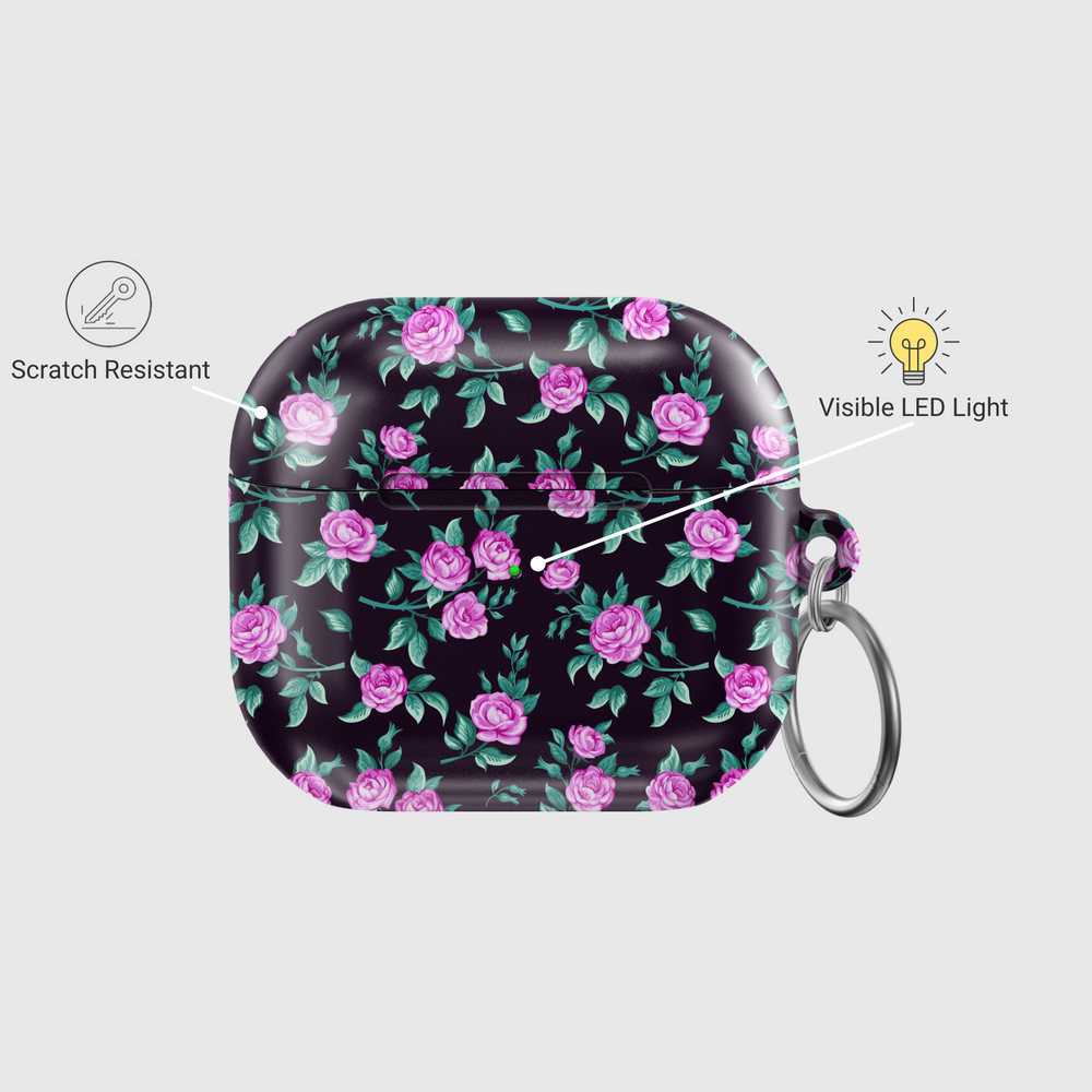 Black AirPods case with tiny blue and white floral print, silver keychain attachment, inspired by indie music vibes and soft aesthetic design for AirPods Pro or AirPods 3.