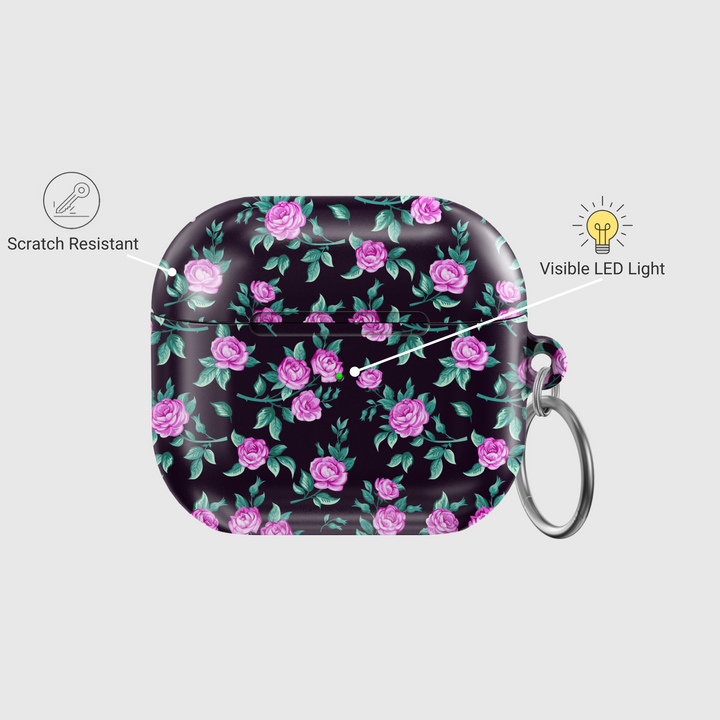 Black AirPods case with tiny blue and white floral print, silver keychain attachment, inspired by indie music vibes and soft aesthetic design for AirPods Pro or AirPods 3.