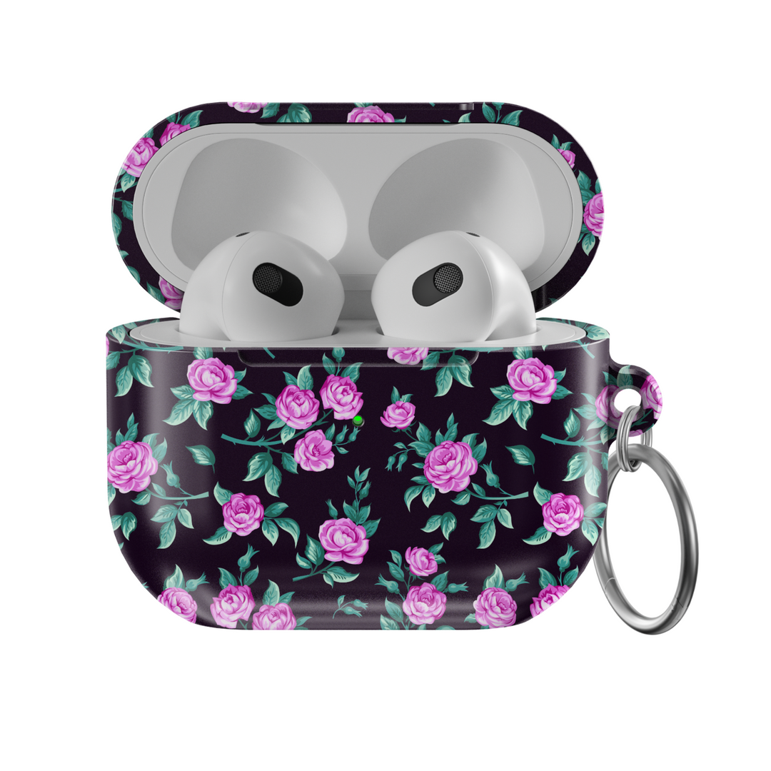 Black AirPods case with tiny blue and white floral print, silver keychain attachment, inspired by indie music vibes and soft aesthetic design for AirPods Pro or AirPods 3.