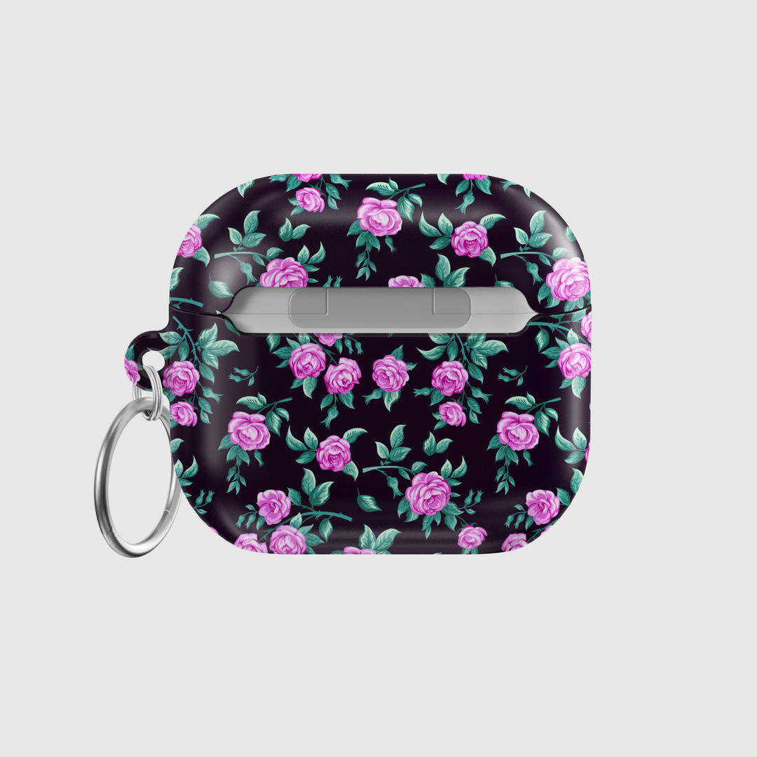 Black AirPods case with tiny blue and white floral print, silver keychain attachment, inspired by indie music vibes and soft aesthetic design for AirPods Pro or AirPods 3.