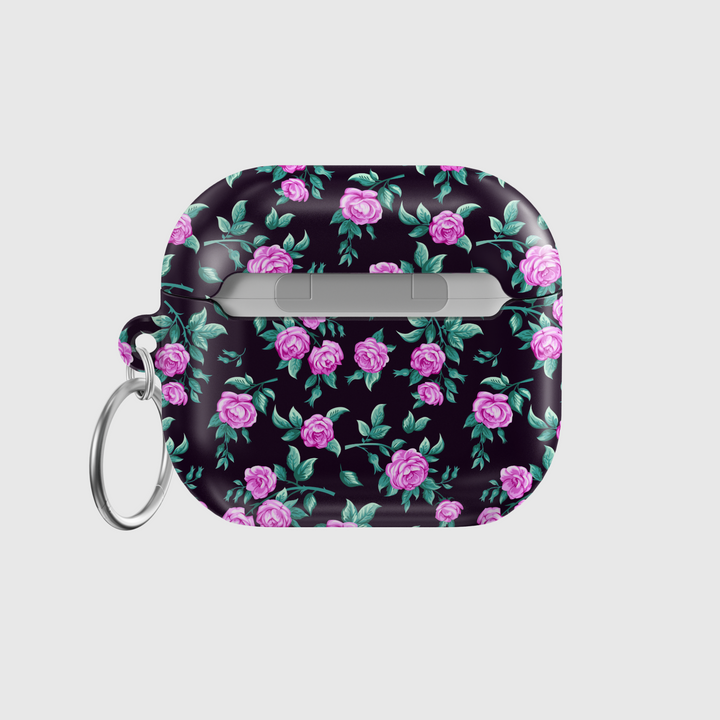 Black AirPods case with tiny blue and white floral print, silver keychain attachment, inspired by indie music vibes and soft aesthetic design for AirPods Pro or AirPods 3.
