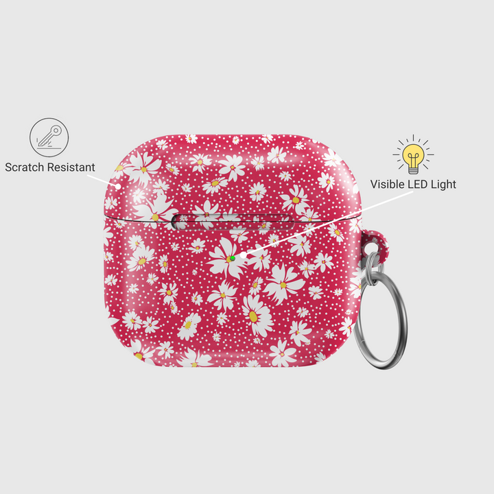 Red AirPods case with white daisy flower pattern and silver keyring, cute floral protective cover for AirPods Pro, retro spring-style accessory.
