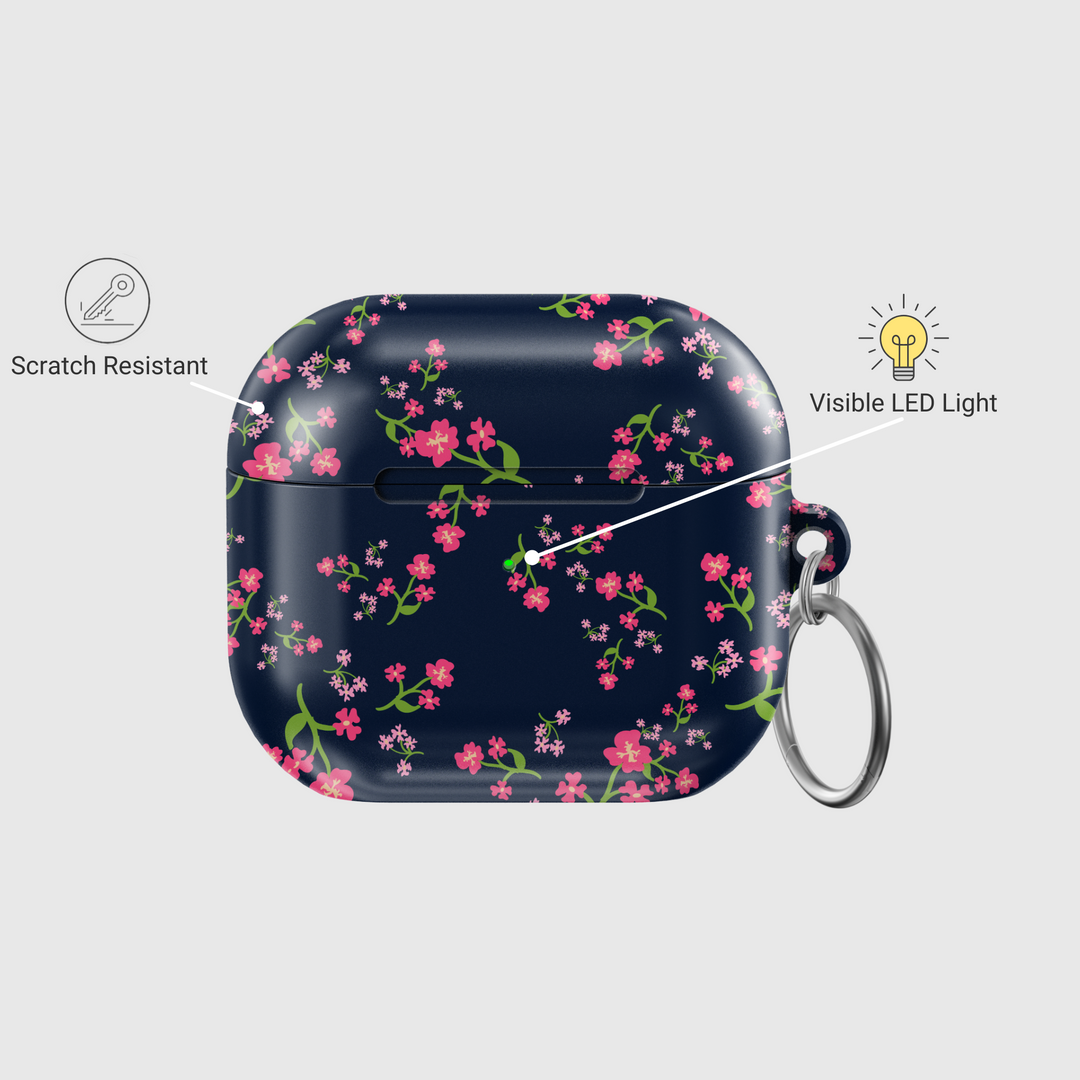 Navy blue AirPods case with pink floral design and silver keyring, cute botanical protective cover for AirPods Pro or AirPods 3.