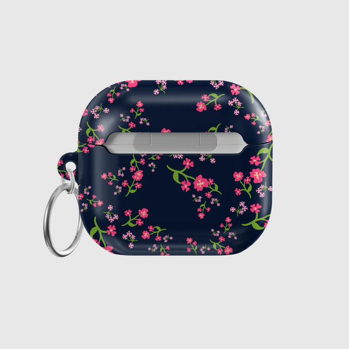 Navy blue AirPods case with pink floral design and silver keyring, cute botanical protective cover for AirPods Pro or AirPods 3.