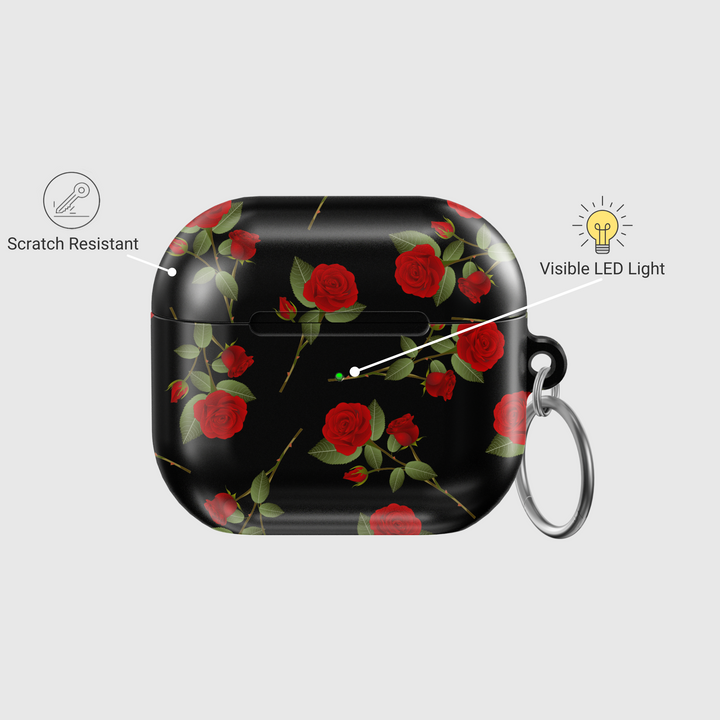 Glossy black AirPods case with red rose floral pattern and silver keyring, romantic aesthetic protective cover for AirPods Pro or AirPods 3.
