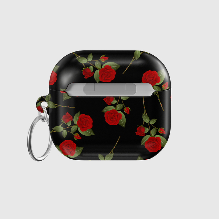 Glossy black AirPods case with red rose floral pattern and silver keyring, romantic aesthetic protective cover for AirPods Pro or AirPods 3.