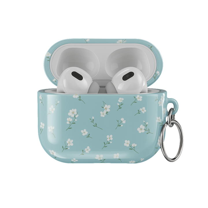 Light blue AirPods case with delicate white floral design and silver keyring, soft minimal aesthetic protective cover for AirPods Pro or AirPods 3.