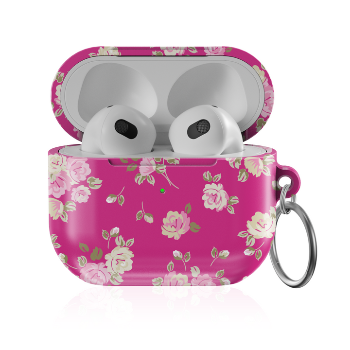 Pink AirPods case featuring vintage rose pattern and keychain ring, glossy finish—stylish and protective accessory for music lovers.