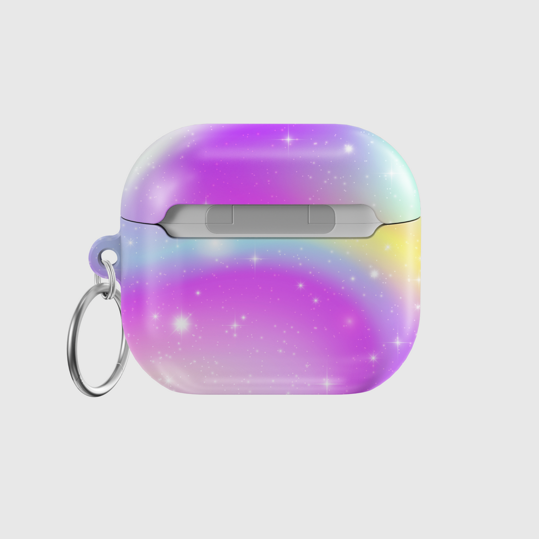 AirPods case featuring a pastel ombre galaxy design with sparkling stars, blending soft purple, pink, blue, and yellow tones, finished with a keychain ring.