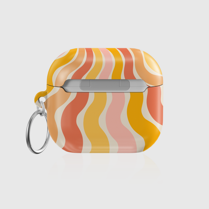Retro AirPods case with orange, yellow, and blush wavy sunray pattern and silver keyring – summer aesthetic tech accessory.