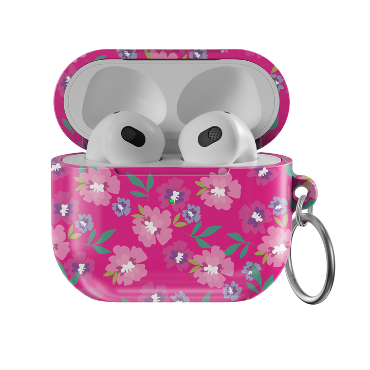 Glossy hot pink AirPods case with colorful floral print featuring white, purple, and pink flowers, includes a silver keychain ring.
