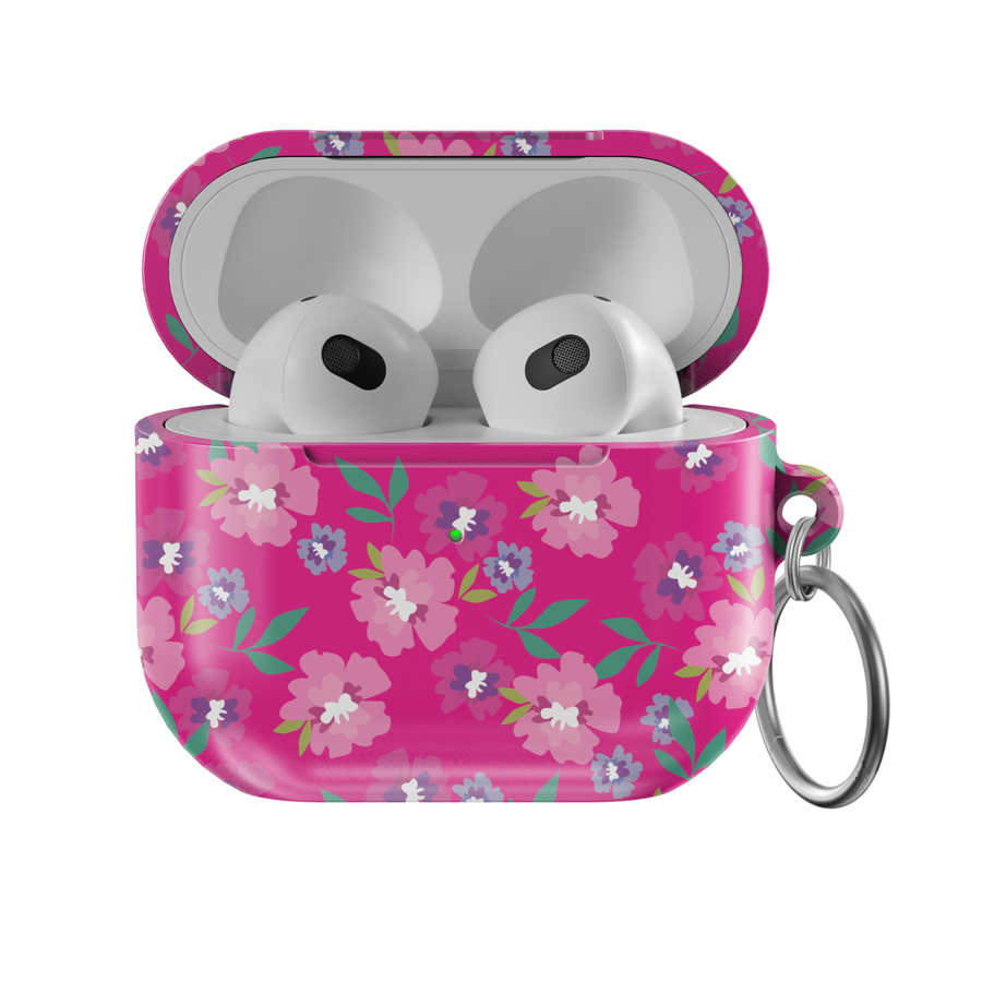 Glossy hot pink AirPods case with colorful floral print featuring white, purple, and pink flowers, includes a silver keychain ring.