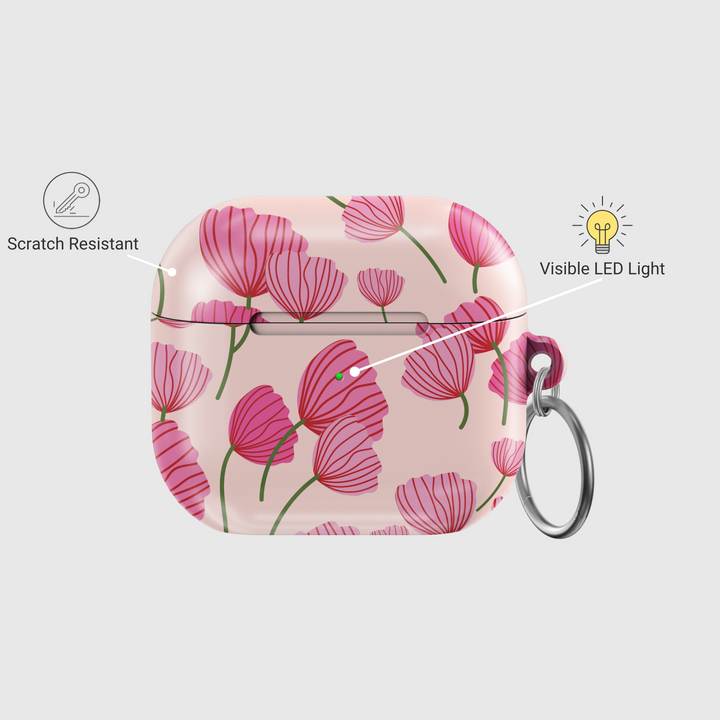 AirPods case with blush pink background featuring stylized red and pink poppy flower design, glossy finish with silver keychain ring.