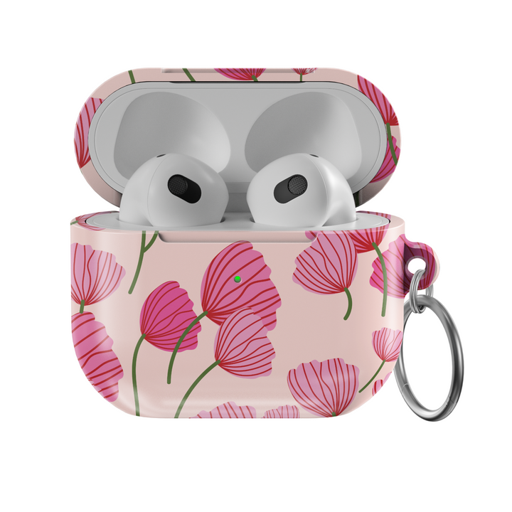 AirPods case with blush pink background featuring stylized red and pink poppy flower design, glossy finish with silver keychain ring.