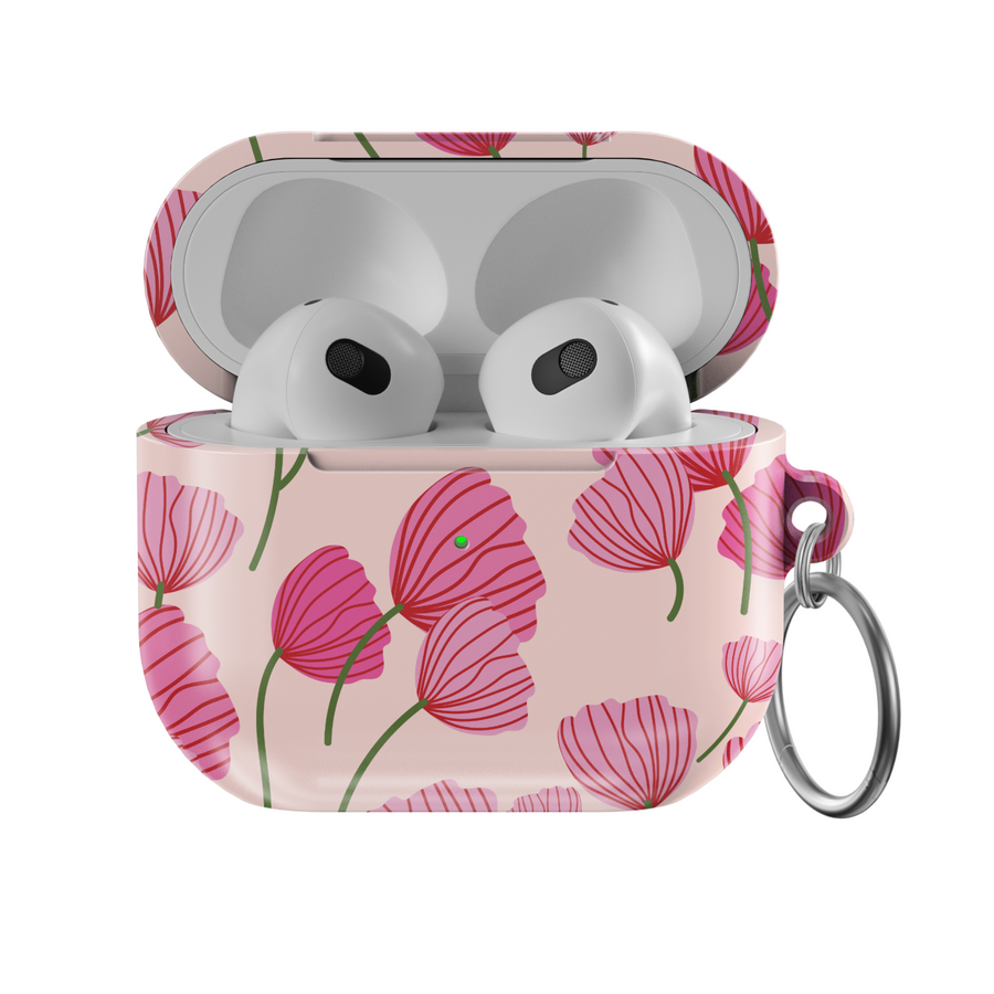 AirPods case with blush pink background featuring stylized red and pink poppy flower design, glossy finish with silver keychain ring.