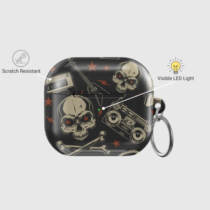 Black AirPods case featuring skull and bones design with retro boombox and red stars, edgy punk rock aesthetic with glossy finish and metal keychain ring.