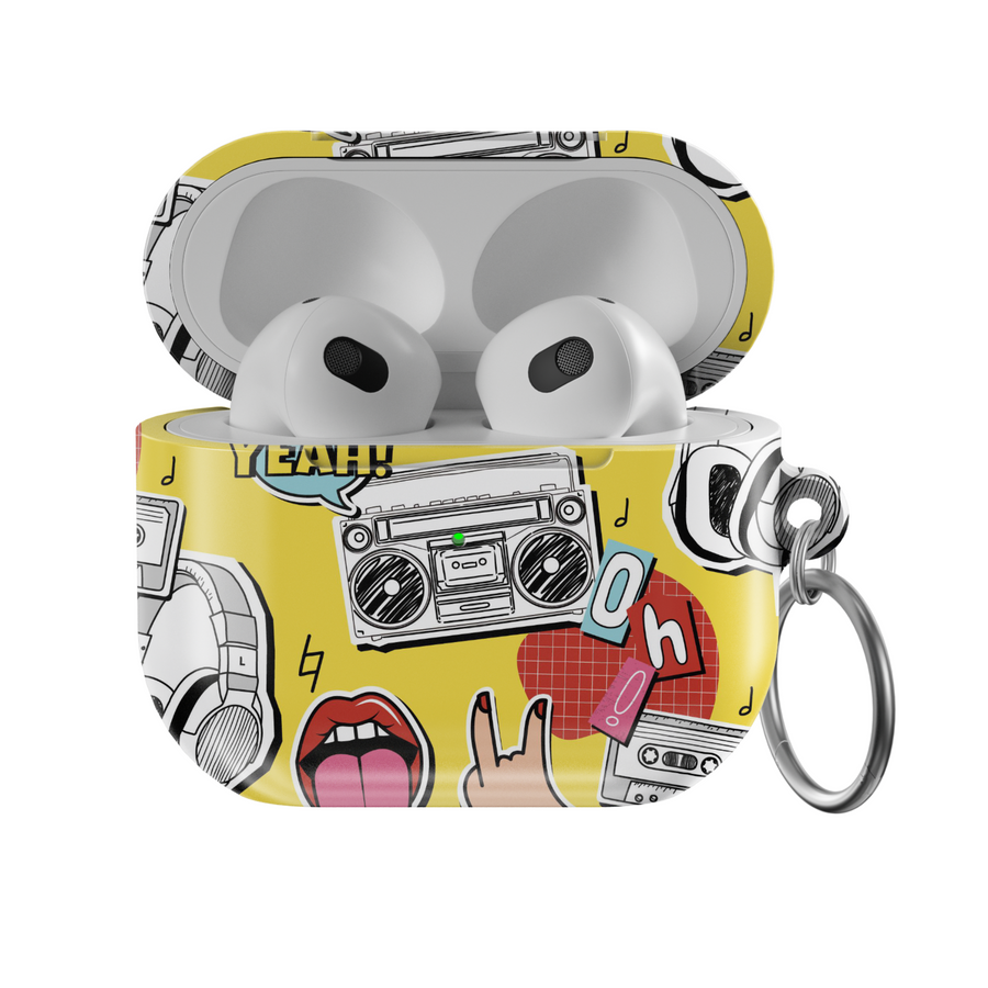 Yellow AirPods case with pop art design featuring boombox, cassette tape, tongue-out lips, headphones, and retro icons in bold cartoon style with a glossy finish and keychain.