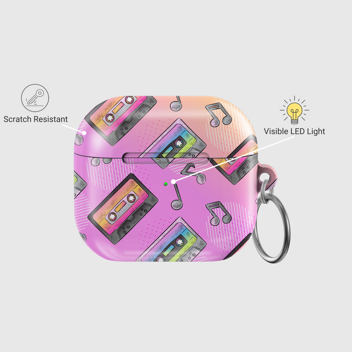 Pink AirPods case featuring colorful cassette tape illustrations and black musical notes, designed in a retro 90s pastel style with a glossy finish and metal keychain loop.