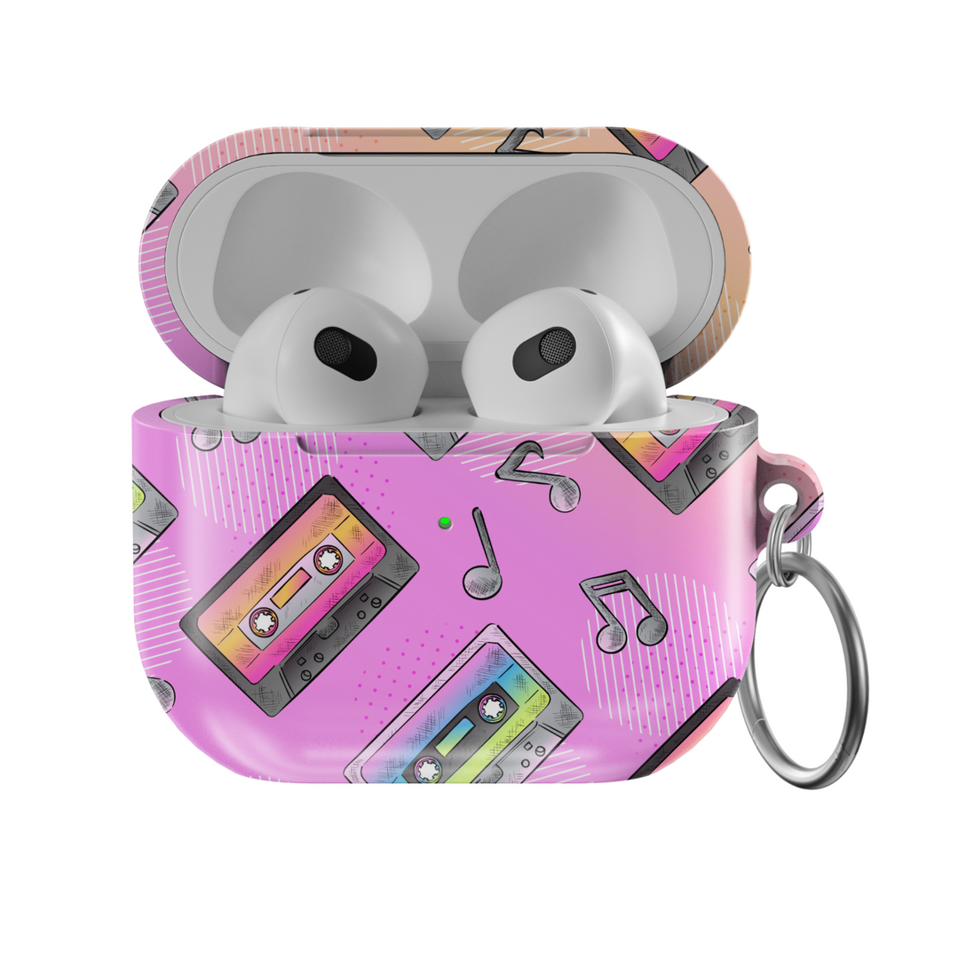 Pink AirPods case featuring colorful cassette tape illustrations and black musical notes, designed in a retro 90s pastel style with a glossy finish and metal keychain loop.