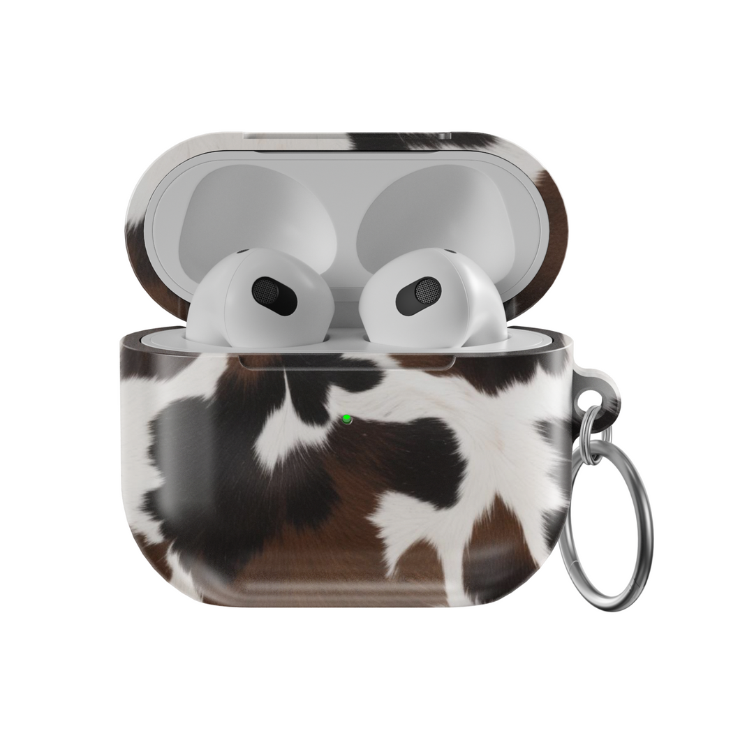 Brown and white cow print AirPods case with glossy finish and silver keychain | Western aesthetic TPU protective cover for AirPods Pro and Gen 1 2 3