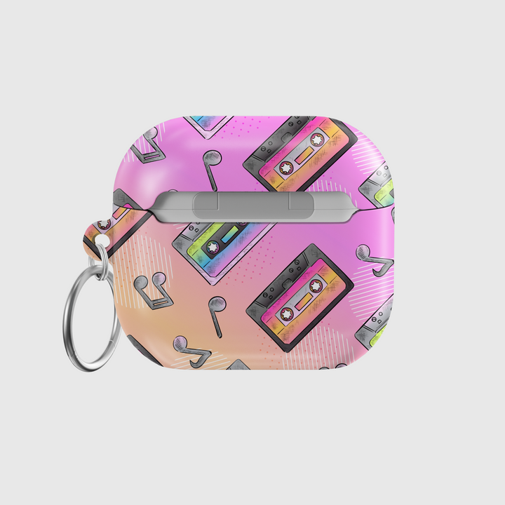 Pink AirPods case featuring colorful cassette tape illustrations and black musical notes, designed in a retro 90s pastel style with a glossy finish and metal keychain loop.