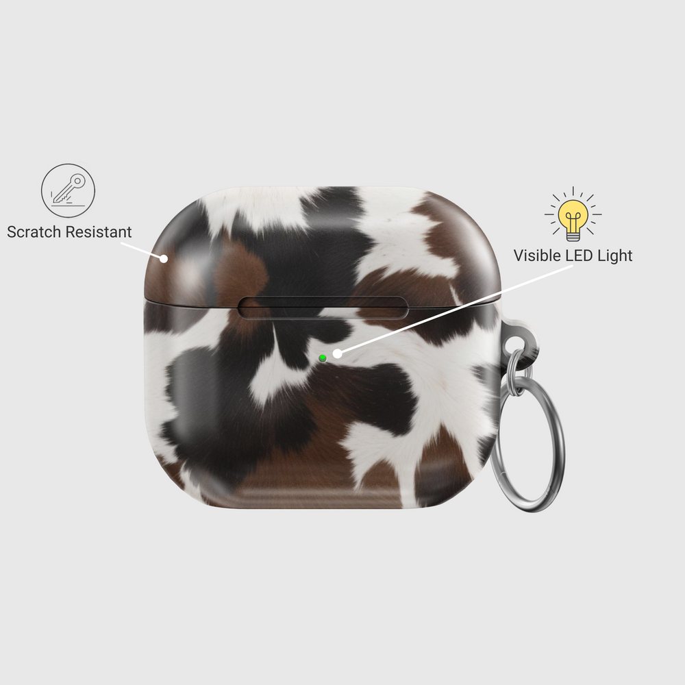 Brown and white cow print AirPods case with glossy finish and silver keychain | Western aesthetic TPU protective cover for AirPods Pro and Gen 1 2 3