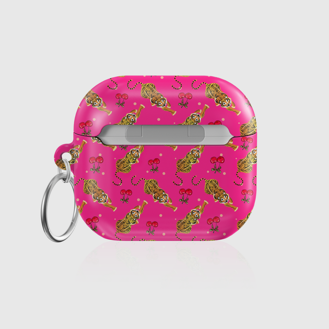 Pink AirPods case cover with playful tiger and cherry pattern, featuring a glossy finish and attached keychain ring. Compatible with AirPods Pro, 3, 2, and 1.