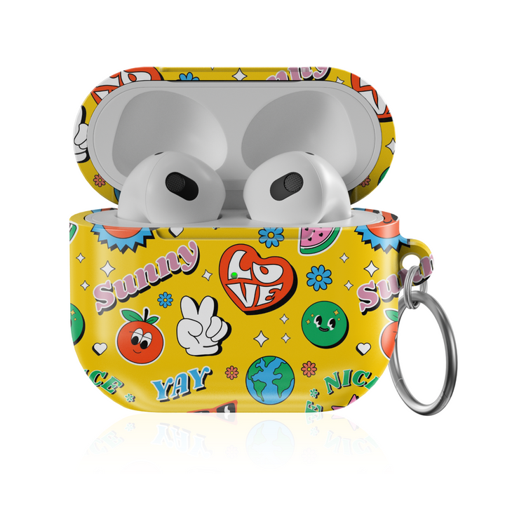Yellow AirPods case with fun retro doodle art including smiley faces, peace sign, love heart, globe, and sunny text, featuring a glossy finish and metal keychain ring. Fits AirPods Pro, 3, 2, and 1 models.