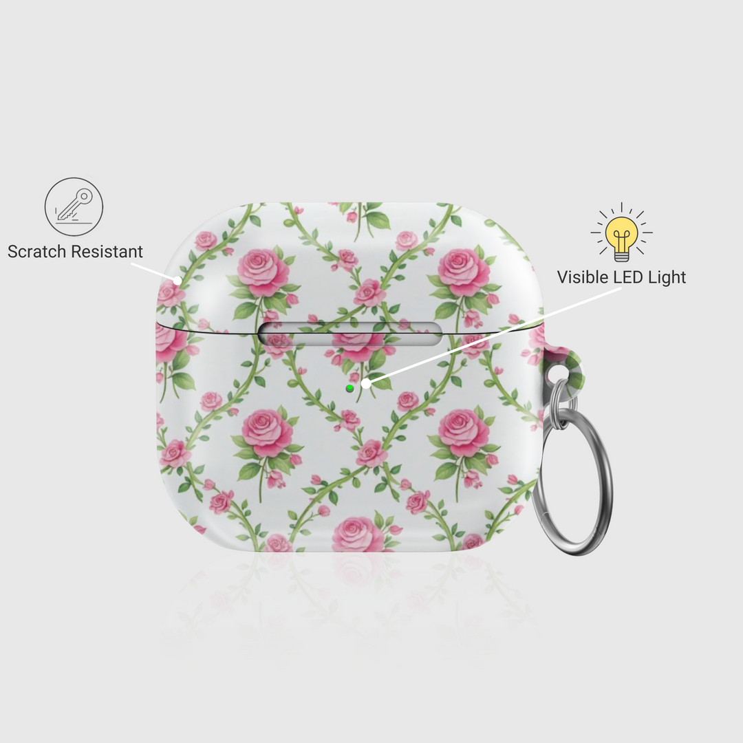 White AirPods case with delicate pink rose vine pattern and keychain ring—vintage floral accessory for stylish music lovers.