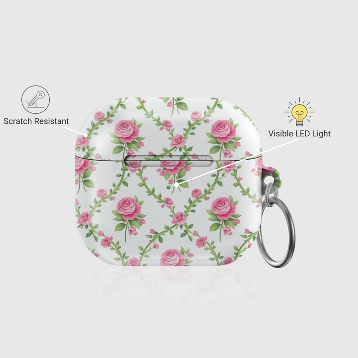 White AirPods case with delicate pink rose vine pattern and keychain ring—vintage floral accessory for stylish music lovers.