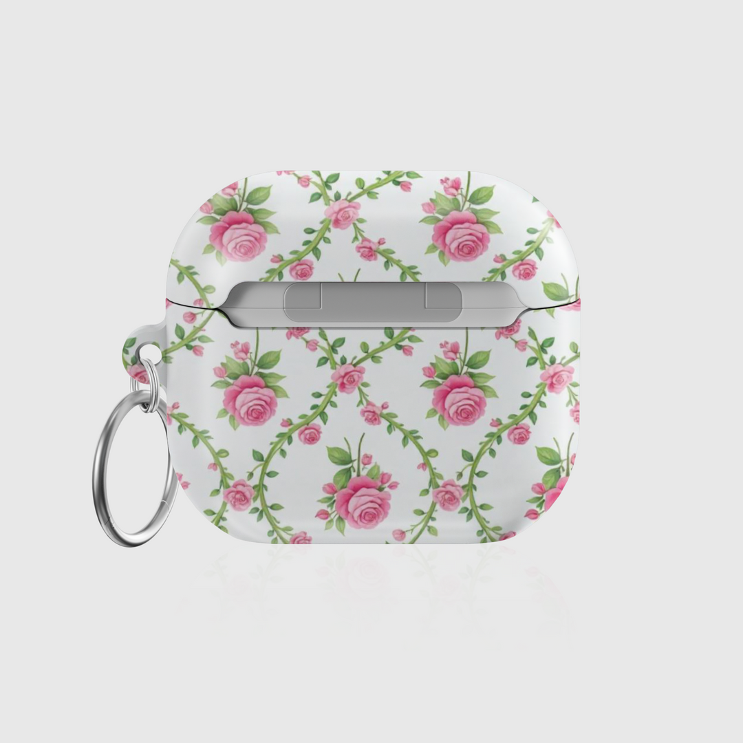 White AirPods case with delicate pink rose vine pattern and keychain ring—vintage floral accessory for stylish music lovers.