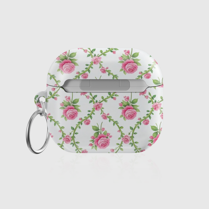 White AirPods case with delicate pink rose vine pattern and keychain ring—vintage floral accessory for stylish music lovers.