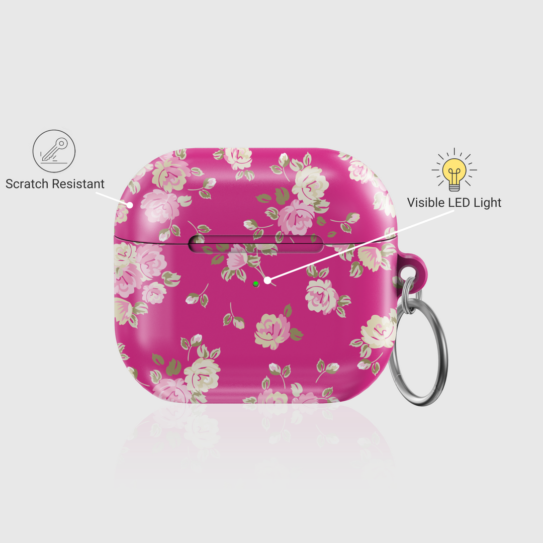 Pink AirPods case featuring vintage rose pattern and keychain ring, glossy finish—stylish and protective accessory for music lovers.