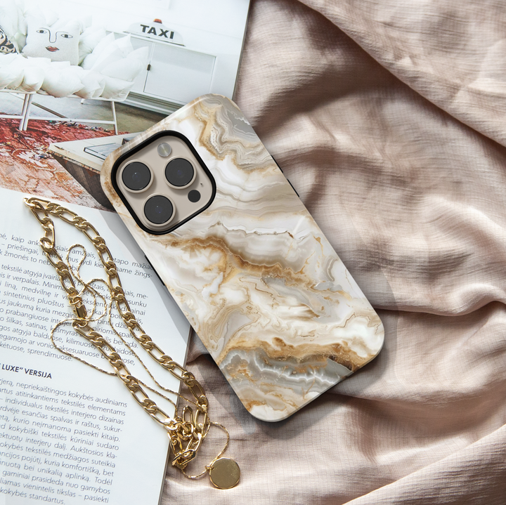 Elegant white marble iPhone case with gold vein accents – luxury stone design cover compatible with iPhone 16, 15, 14 Pro & Plus with MagSafe support.
