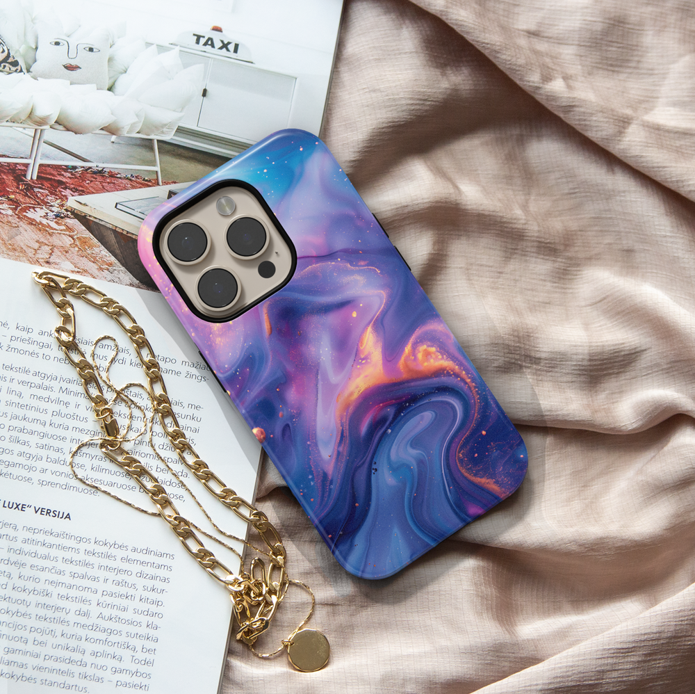 Abstract galaxy swirl iPhone 16 MagSafe case in dreamy purple, blue, and gold tones – aesthetic, protective, and perfect for a cosmic look.